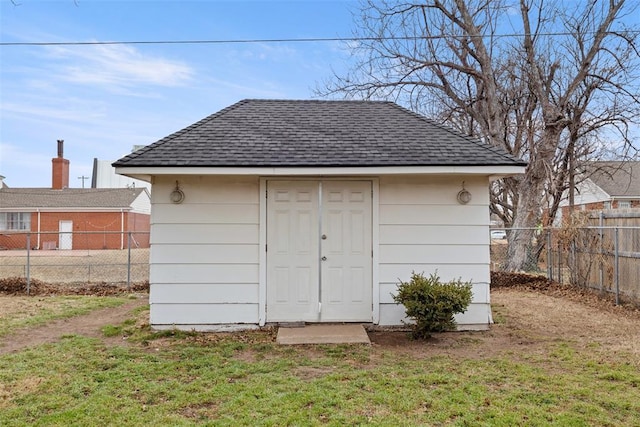 view of outdoor structure featuring a lawn