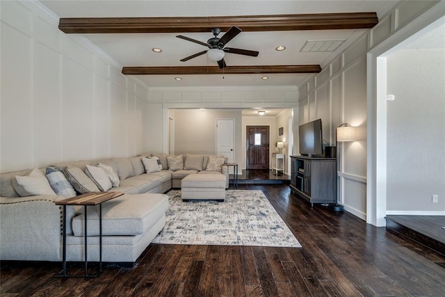 living room with ornamental molding, dark wood-type flooring, ceiling fan, and beam ceiling