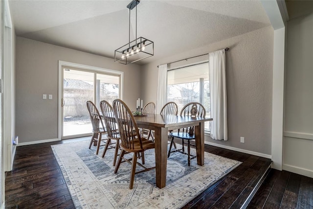 dining space featuring dark hardwood / wood-style floors