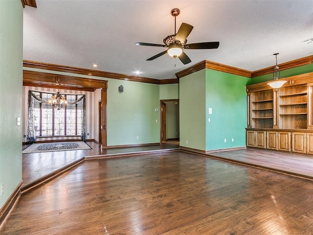 unfurnished living room featuring ornamental molding, dark hardwood / wood-style flooring, and a textured ceiling