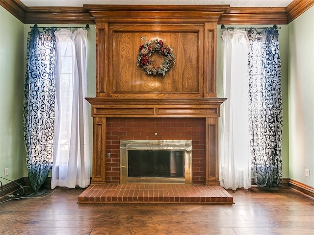 details featuring hardwood / wood-style flooring, a fireplace, and crown molding