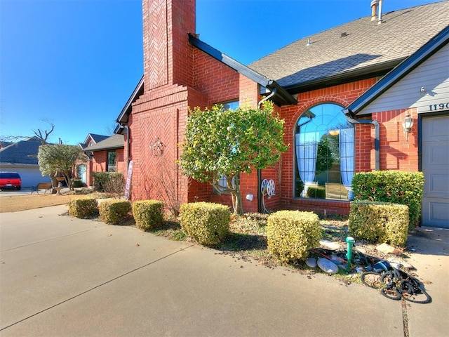 view of property exterior featuring a garage