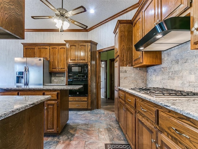 kitchen with extractor fan, crown molding, light stone counters, a textured ceiling, and black appliances