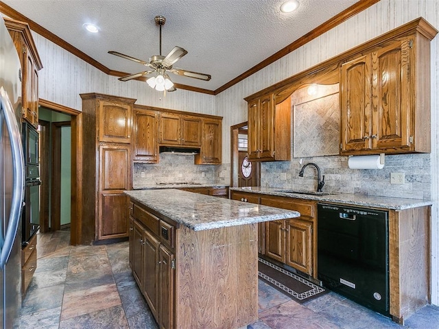 kitchen featuring black dishwasher, sink, ornamental molding, a center island, and light stone countertops