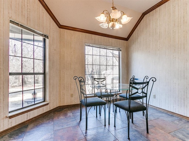 dining room with crown molding, vaulted ceiling, and a wealth of natural light