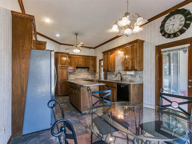 kitchen featuring stainless steel refrigerator, dishwasher, a center island, ornamental molding, and light stone countertops