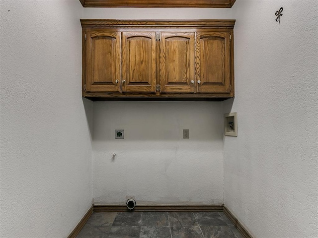 laundry area with cabinets, washer hookup, hookup for a gas dryer, and electric dryer hookup