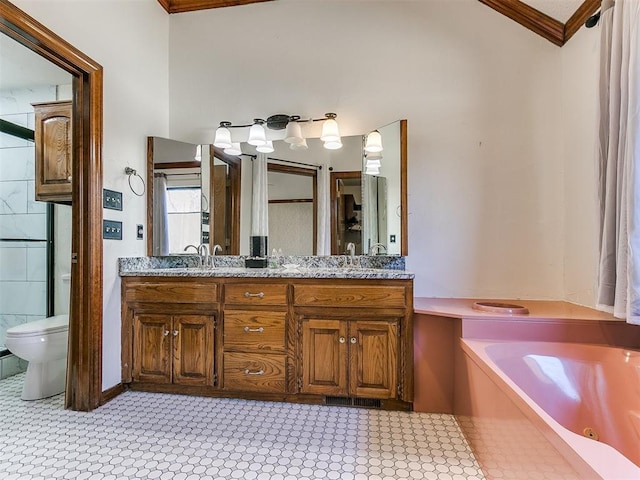 bathroom featuring vanity, a bath, crown molding, and toilet