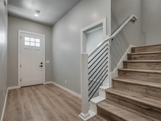 entryway with light hardwood / wood-style floors