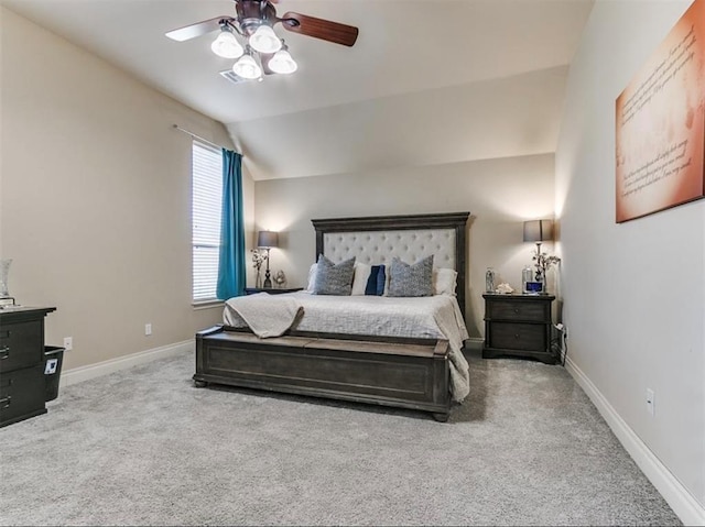 bedroom with carpet floors, ceiling fan, and vaulted ceiling