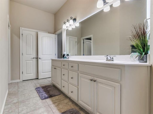 bathroom featuring tile patterned flooring and vanity