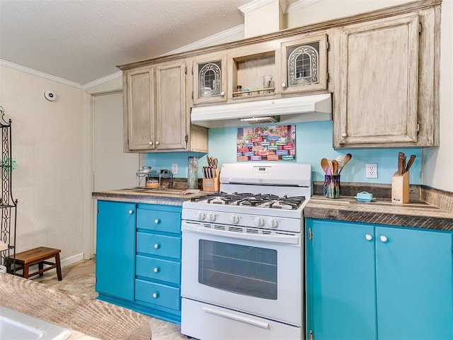 kitchen featuring ornamental molding, a textured ceiling, light brown cabinetry, and white gas range oven