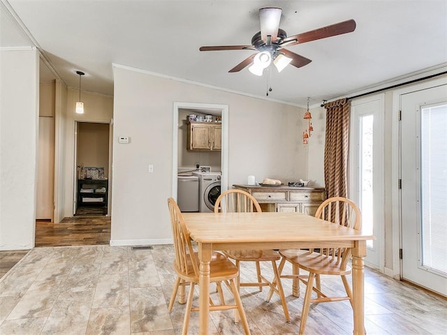 dining room featuring crown molding, independent washer and dryer, and ceiling fan