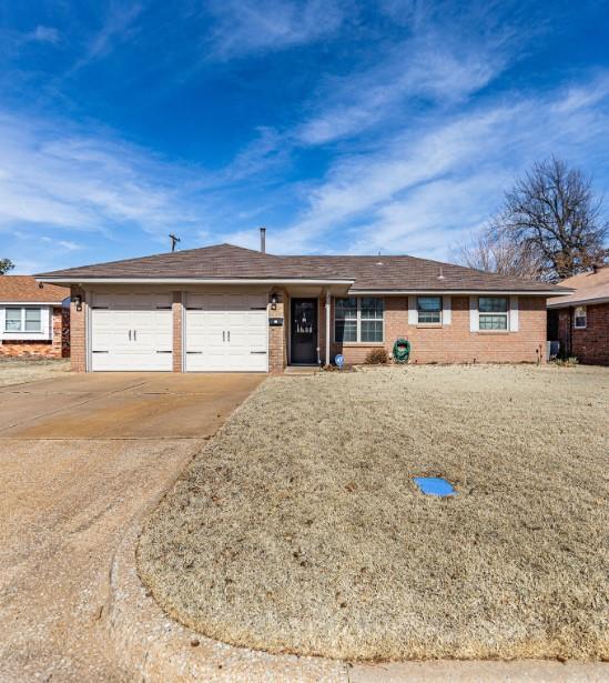 ranch-style house featuring a garage