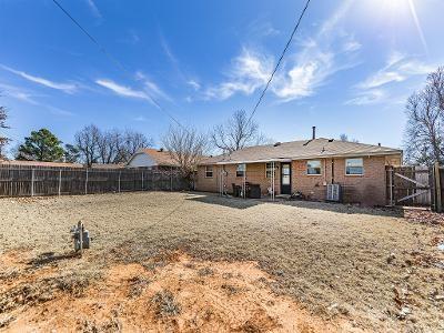 back of property featuring central AC unit