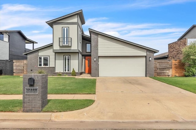 view of front of home with a garage and a front yard