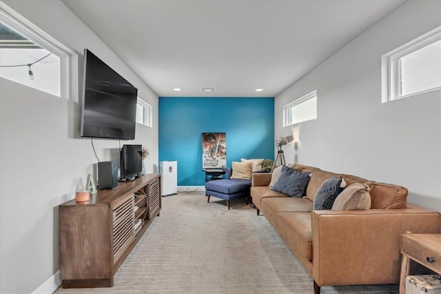 carpeted living room featuring a wealth of natural light