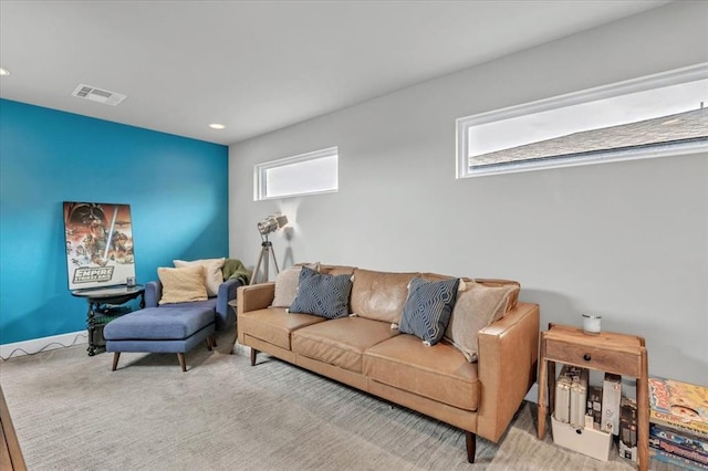 carpeted living room with a healthy amount of sunlight