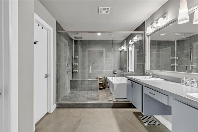 bathroom featuring vanity, independent shower and bath, and concrete floors