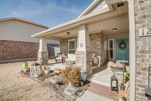 doorway to property featuring covered porch