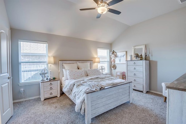 bedroom featuring lofted ceiling, light colored carpet, and ceiling fan