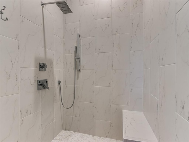 bathroom with tiled shower