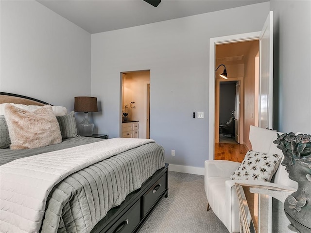 carpeted bedroom with ensuite bath