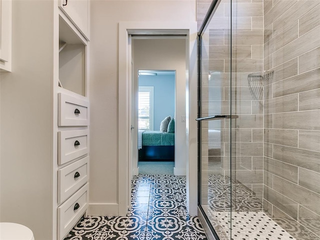 bathroom with tile patterned flooring and walk in shower