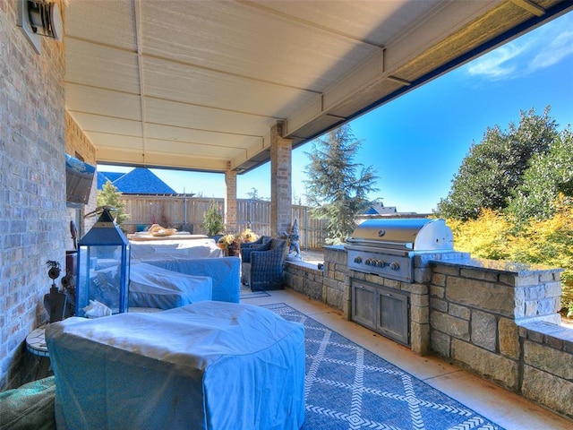 view of patio featuring an outdoor kitchen and grilling area