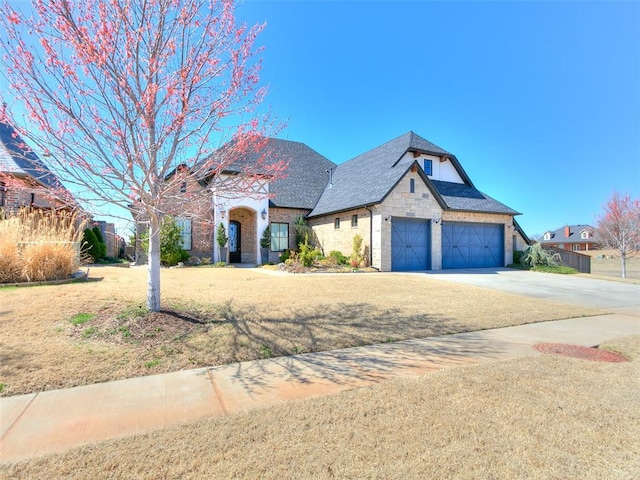 3208 Rolling Woods Dr, Norman, OK 73072 - view of front of property featuring fence, a shingled roof, concrete driveway, a front lawn, and a garage