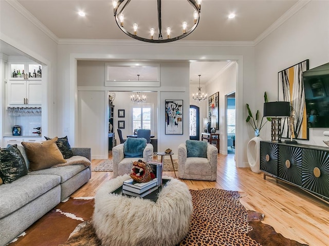 3208 Rolling Woods Dr, Norman, OK 73072 - living area with plenty of natural light, an inviting chandelier, wood finished floors, and crown molding
