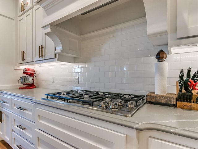 3208 Rolling Woods Dr, Norman, OK 73072 - kitchen featuring white cabinets, glass insert cabinets, tasteful backsplash, and stainless steel gas cooktop