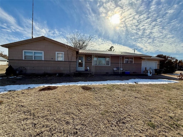 single story home with a garage