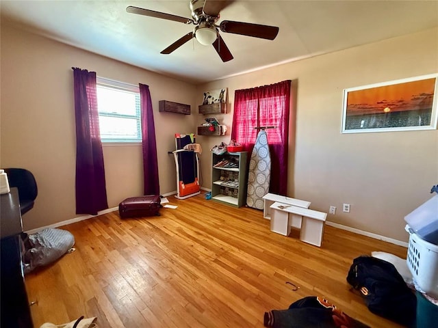 interior space with hardwood / wood-style flooring and ceiling fan