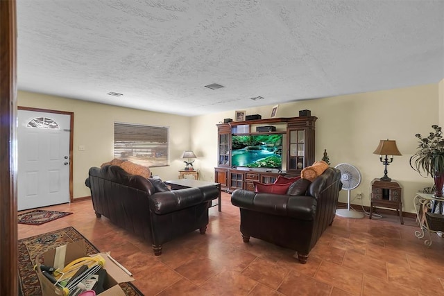 living room featuring a textured ceiling