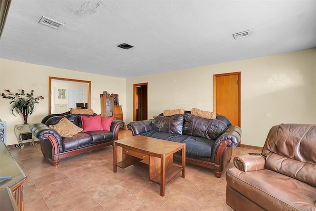 living room with a textured ceiling