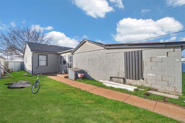 back of property featuring a lawn