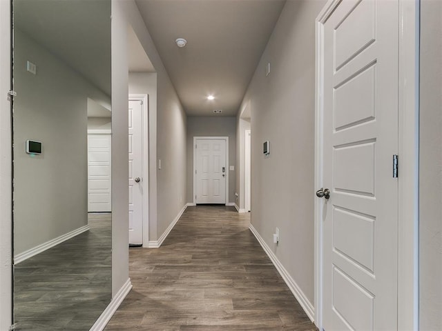 hallway featuring dark wood-type flooring