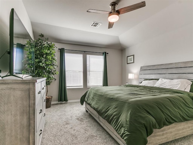 bedroom featuring light carpet, lofted ceiling, and ceiling fan