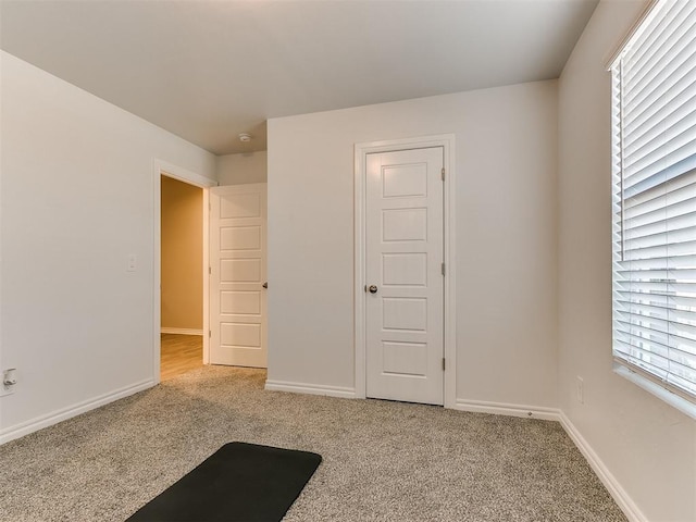 interior space featuring light colored carpet