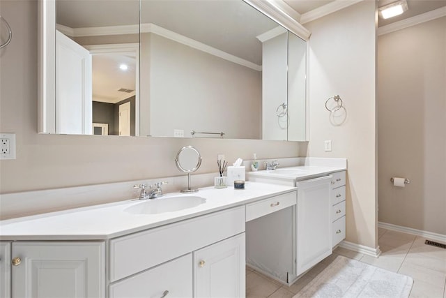 bathroom featuring tile patterned floors, ornamental molding, and vanity