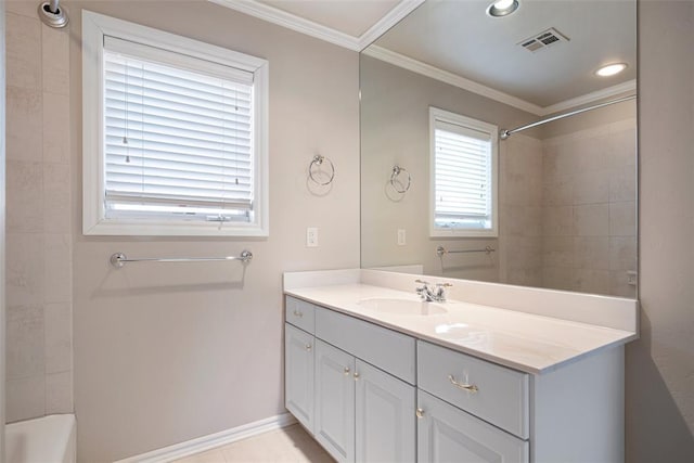 bathroom featuring vanity, tiled shower / bath combo, and ornamental molding