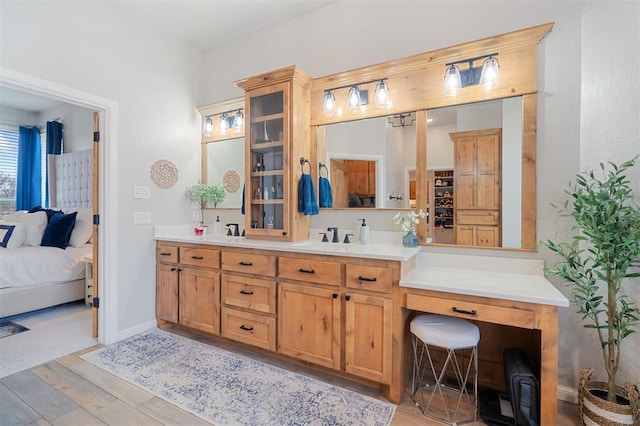 bathroom featuring vanity and hardwood / wood-style floors