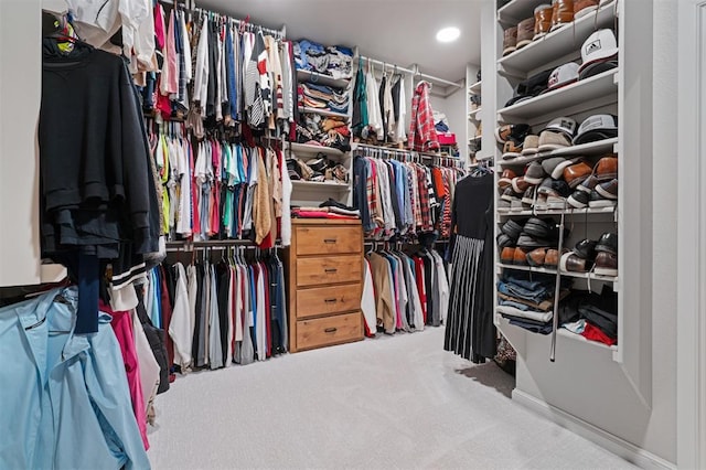 spacious closet with carpet