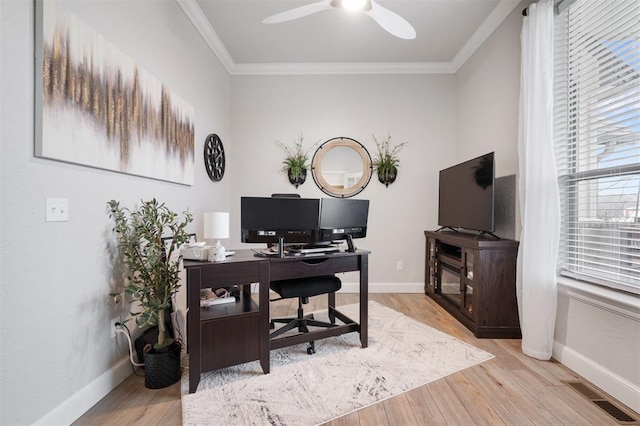 home office featuring crown molding, ceiling fan, and light hardwood / wood-style floors