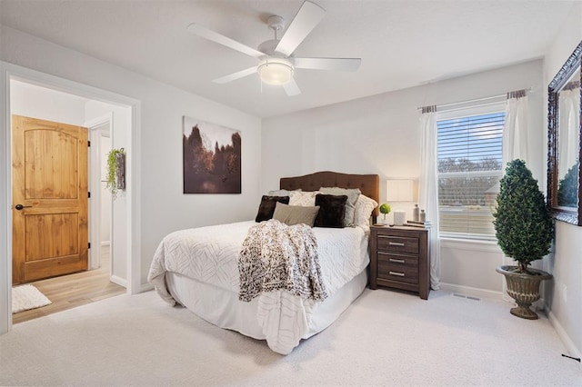 carpeted bedroom with ceiling fan