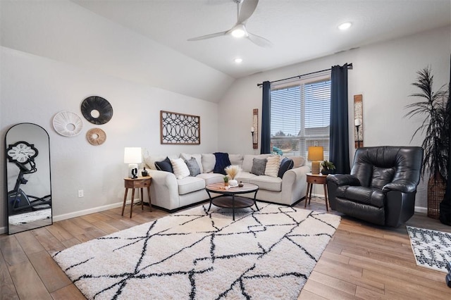 living room with lofted ceiling, light hardwood / wood-style flooring, and ceiling fan