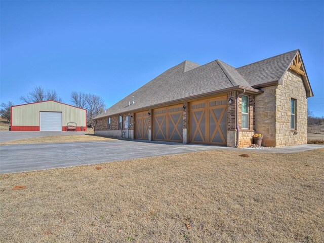 view of side of home with a lawn