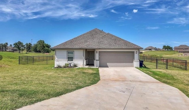 view of front of house with a garage and a front yard