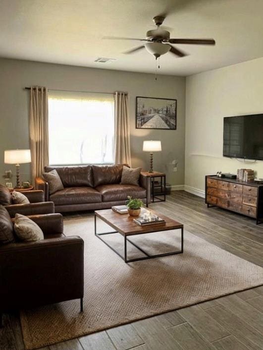 living room featuring hardwood / wood-style floors and ceiling fan